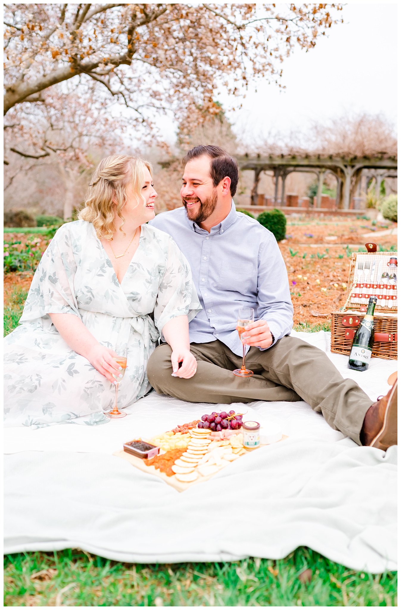 couple having a picnic during their engagement session