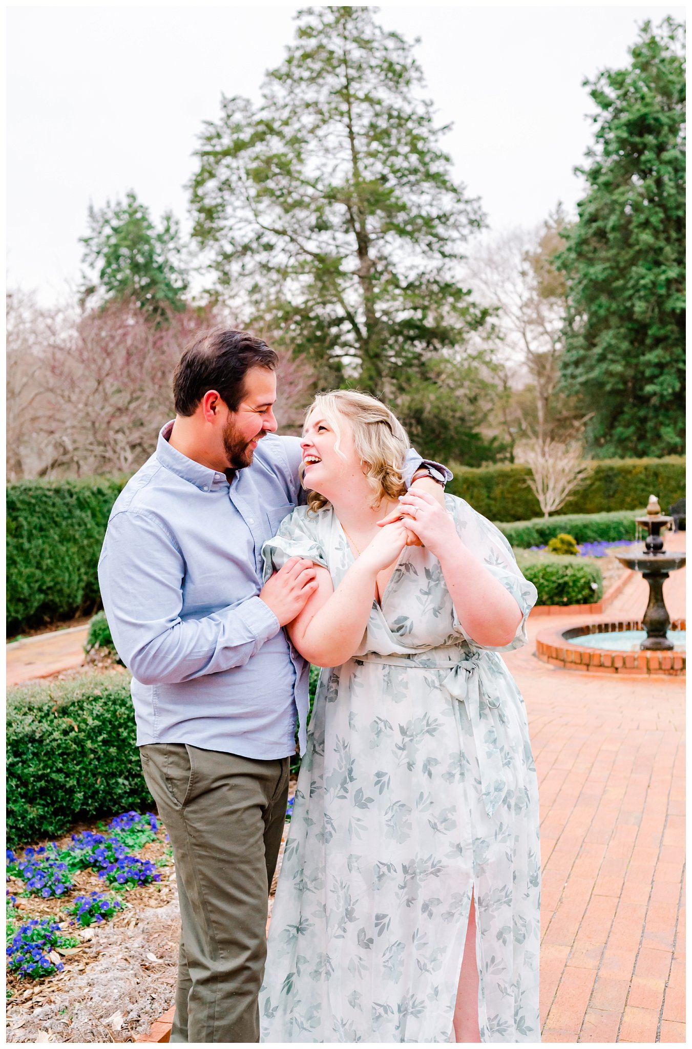 couple laughing in a garden for their Winston Salem engagement session