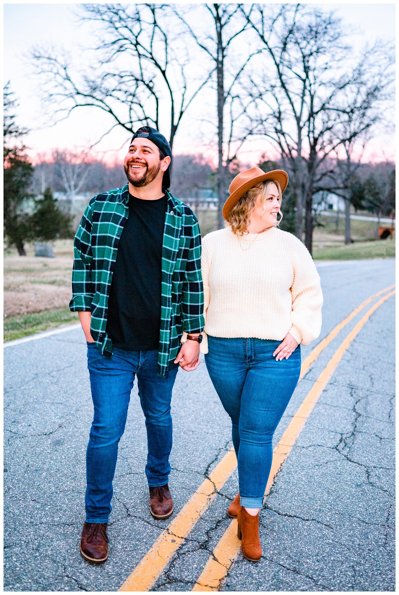 hip couple in the road during twilight for their engagement session