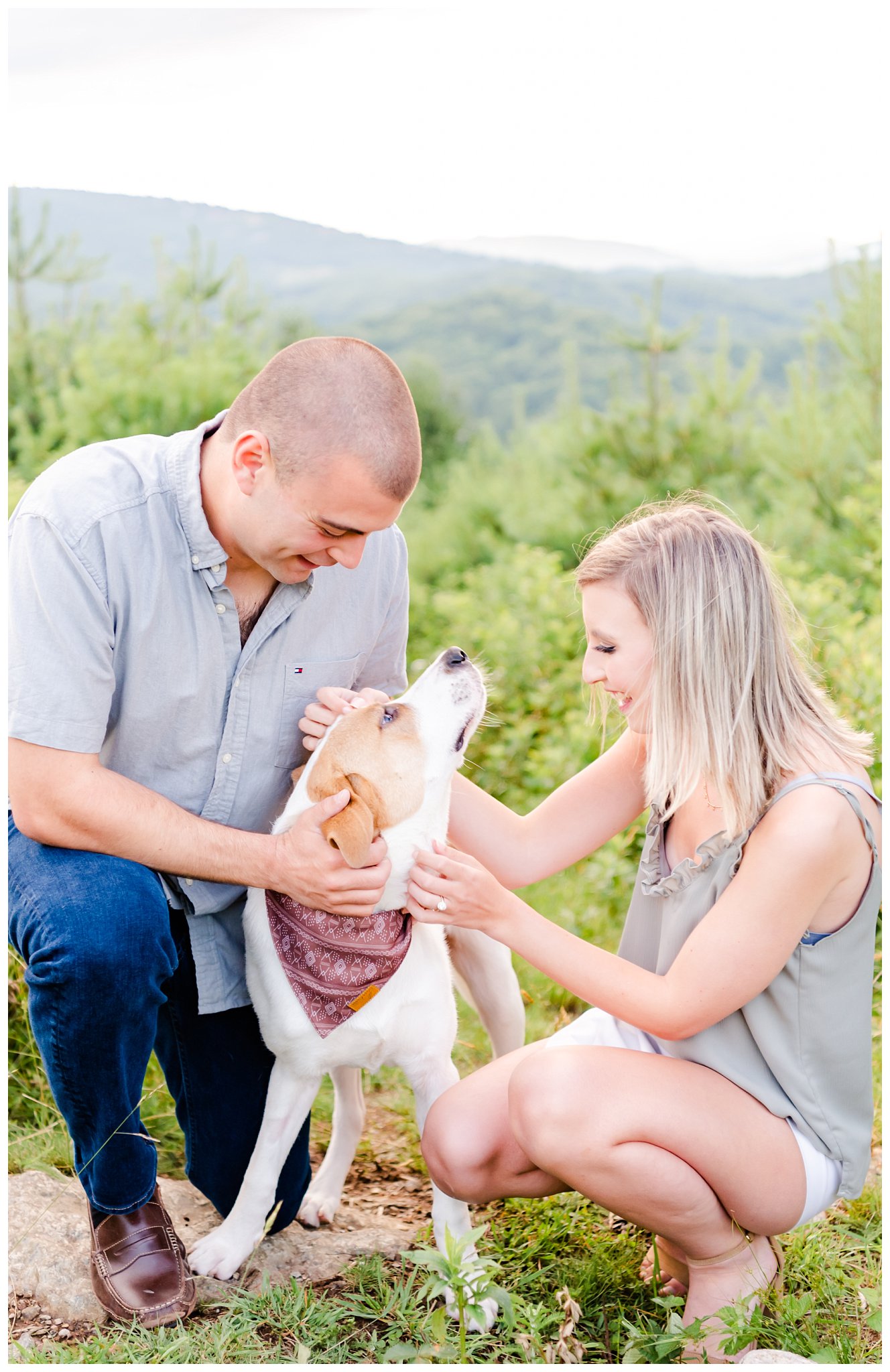 couple poses with dog for their anniversary session in the blue ridge mountains
