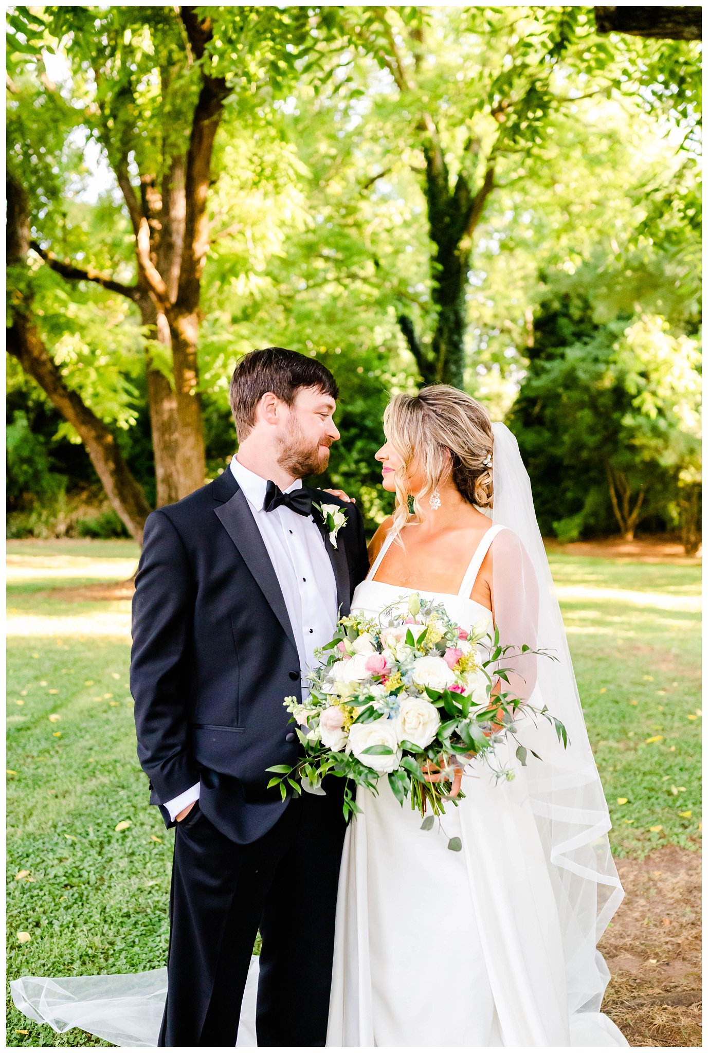 outdoor photo of bride and groom for their North Carolina summer wedding