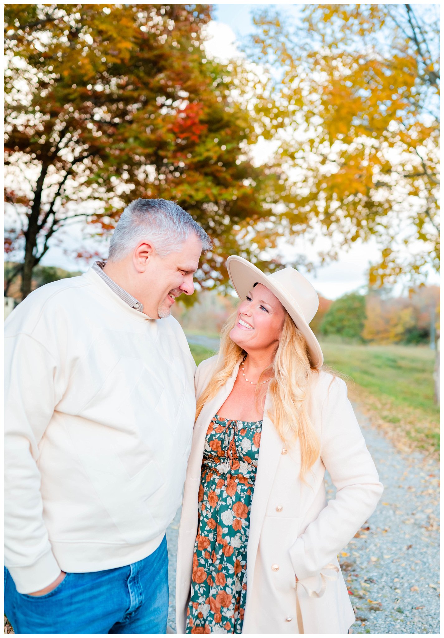 couple smiles for their fall family session